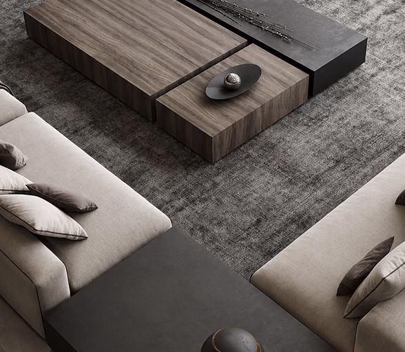 Overhead view of a wood coffee table between two sofas on a textured rug